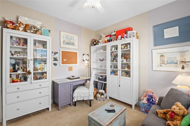 interior space with light carpet and ceiling fan