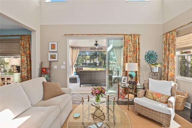 living area featuring a towering ceiling