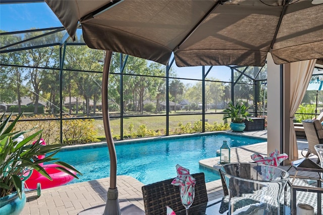 pool featuring a lanai and a patio area