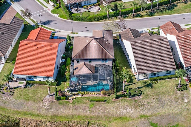 birds eye view of property with a residential view