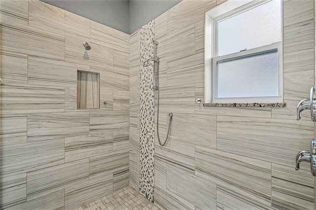 full bath featuring a tile shower