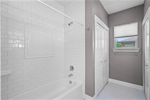 bathroom with tile patterned flooring, washtub / shower combination, baseboards, and a closet