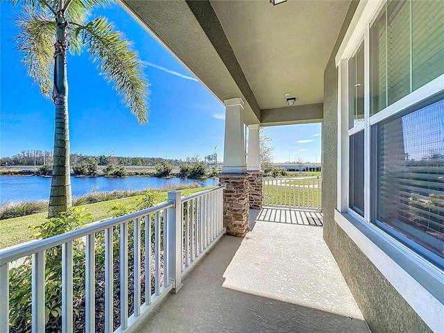 balcony with a porch and a water view