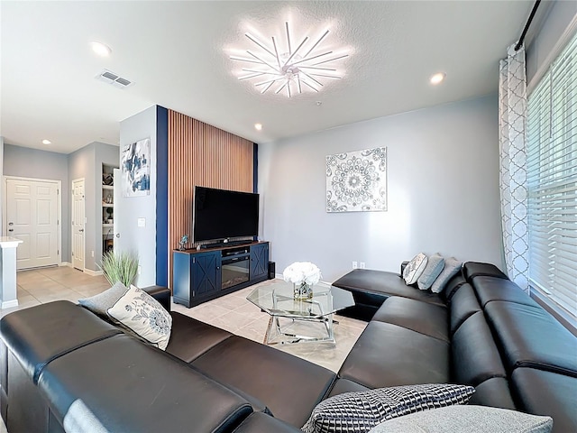 living area featuring recessed lighting, visible vents, and light tile patterned floors