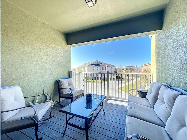 balcony featuring a residential view and an outdoor living space