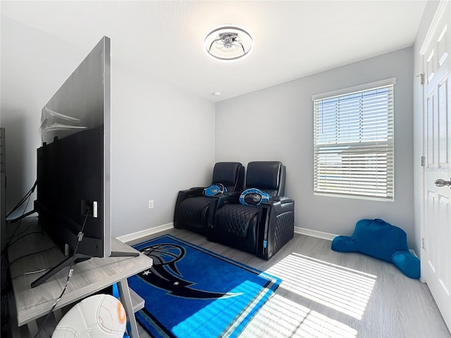 interior space featuring baseboards and wood finished floors