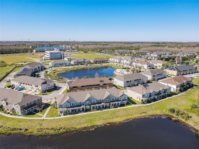 bird's eye view featuring a residential view and a water view