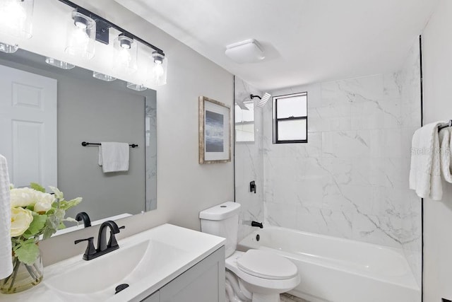 bathroom featuring shower / washtub combination, vanity, and toilet