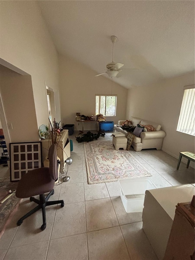 living room with lofted ceiling, tile patterned flooring, and a ceiling fan