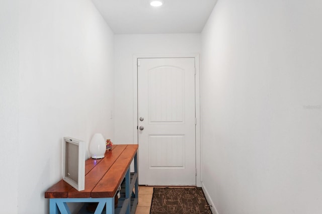 doorway to outside featuring light tile patterned floors