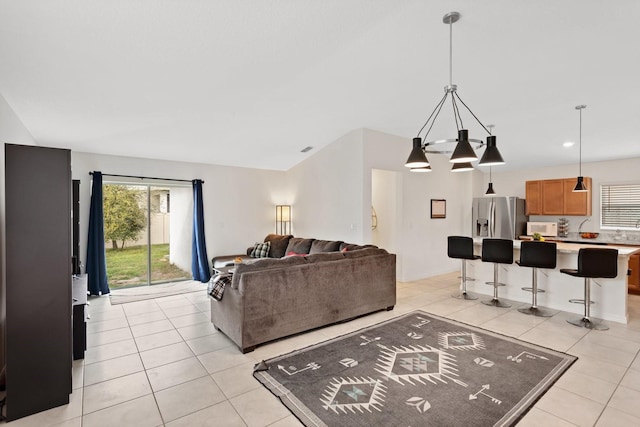 living room featuring recessed lighting, visible vents, and light tile patterned floors