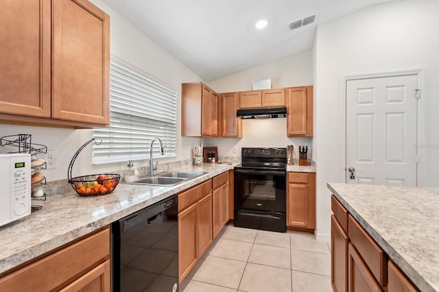 kitchen featuring visible vents, under cabinet range hood, light countertops, black appliances, and a sink