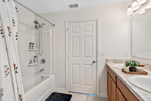 full bathroom featuring double vanity, shower / tub combo, visible vents, tile patterned flooring, and a sink