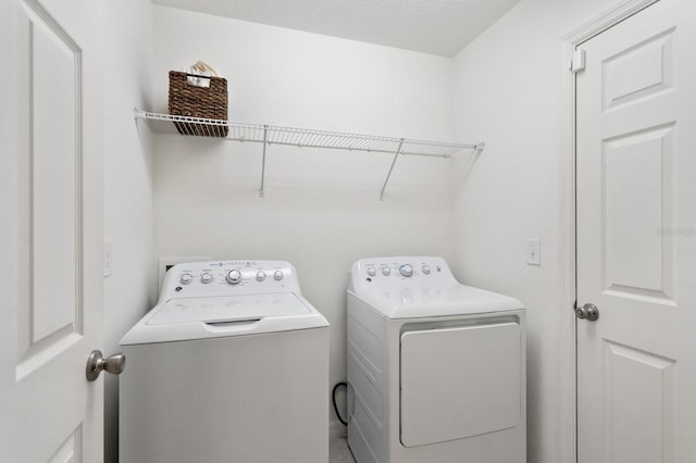 laundry area with laundry area and independent washer and dryer