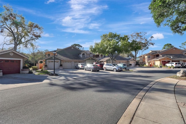 view of street with a residential view, curbs, and sidewalks