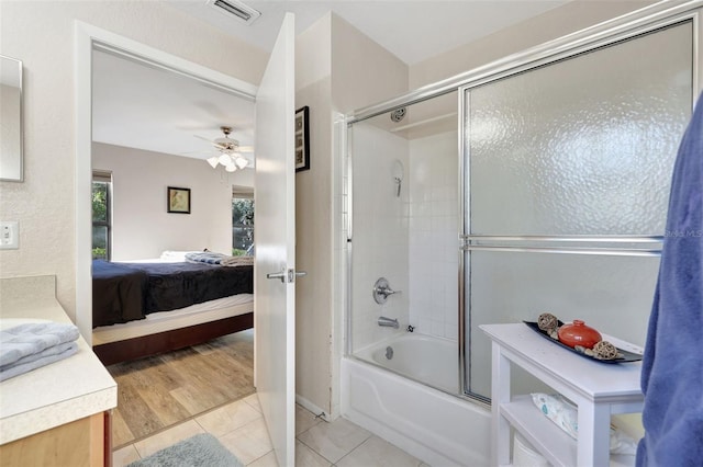 bathroom with vanity, visible vents, tile patterned flooring, combined bath / shower with glass door, and connected bathroom