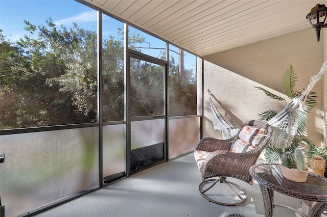 unfurnished sunroom featuring wooden ceiling