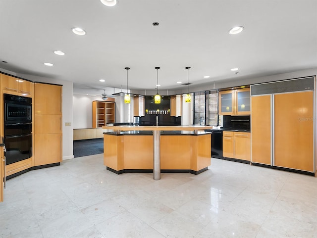 kitchen featuring a kitchen island, glass insert cabinets, black appliances, pendant lighting, and recessed lighting