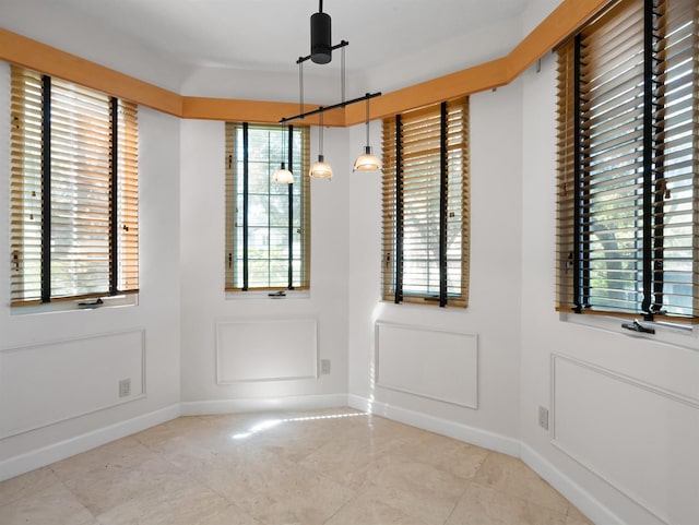 doorway to outside featuring baseboards