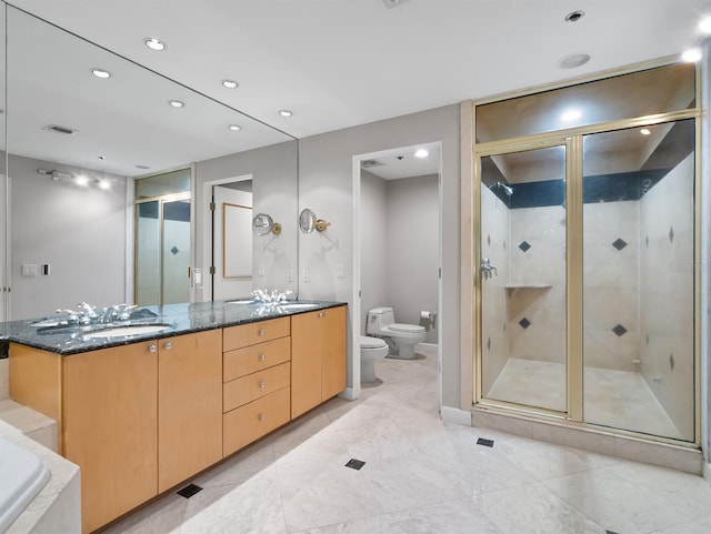 full bath with a stall shower, visible vents, toilet, a bidet, and a sink