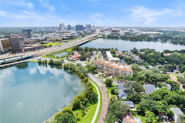 birds eye view of property featuring a water view and a city view