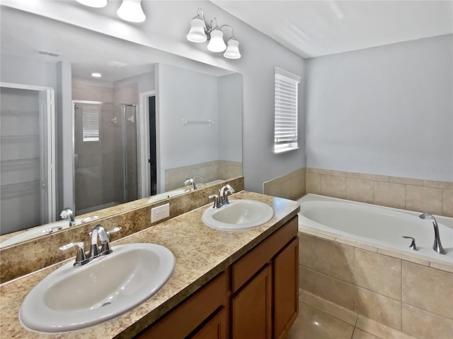 full bath featuring a bath, a stall shower, double vanity, and a sink