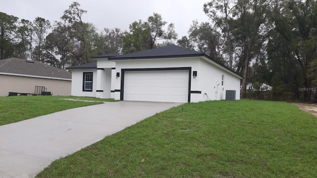 single story home with a front yard, driveway, an attached garage, and stucco siding