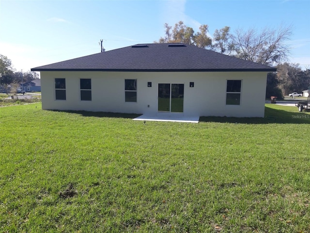 13215 SW 41st Ct, Ocala, FL 34473 - back of house featuring a patio, stucco siding, and a yard