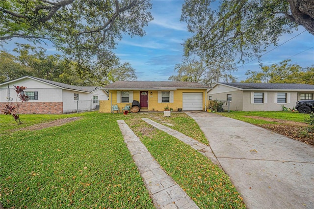 single story home with driveway, an attached garage, fence, a front yard, and brick siding