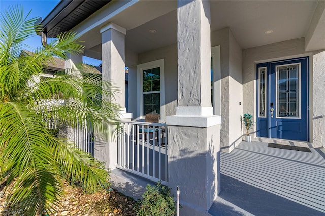 view of exterior entry featuring stucco siding