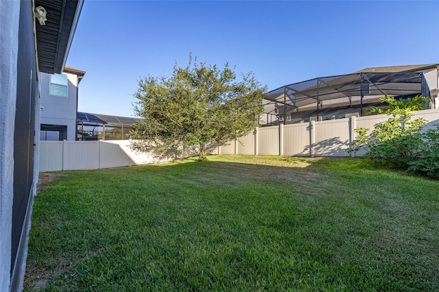 view of yard with a fenced backyard