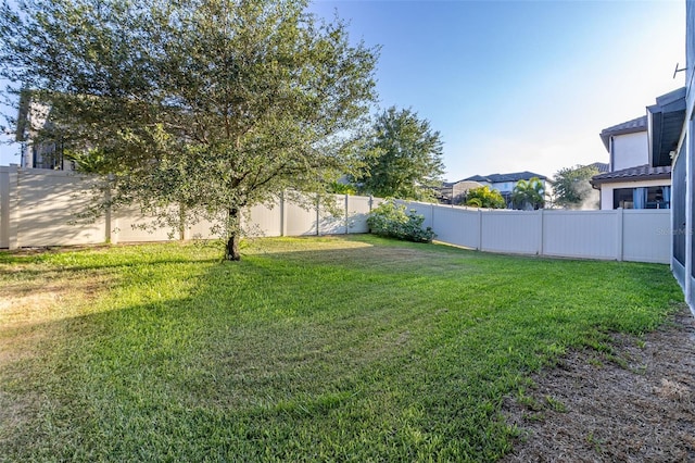 view of yard featuring a fenced backyard