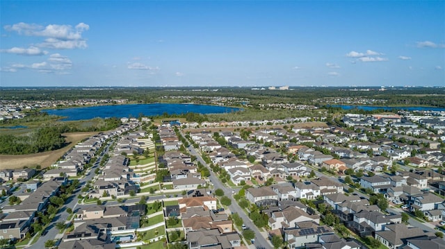 bird's eye view featuring a residential view and a water view