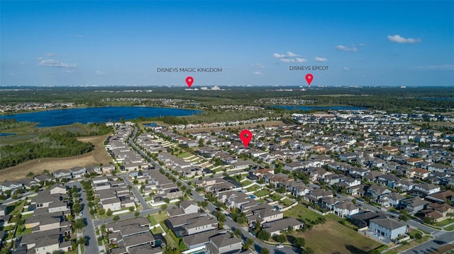 bird's eye view featuring a residential view and a water view