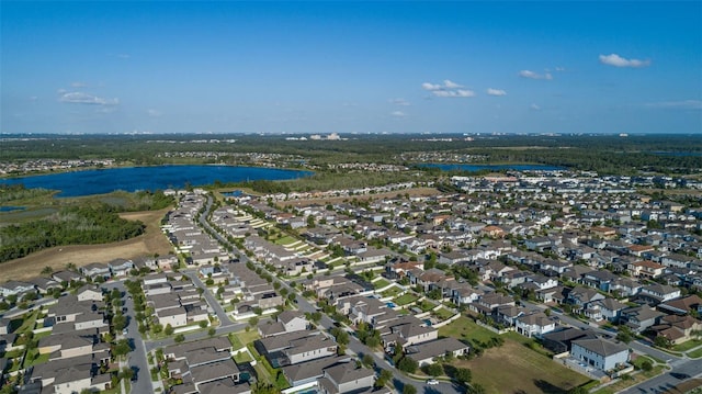 birds eye view of property with a water view and a residential view