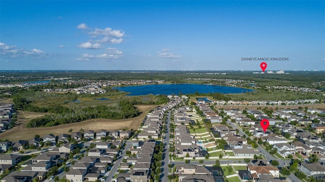 bird's eye view with a residential view and a water view