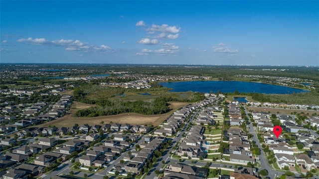 bird's eye view with a water view and a residential view