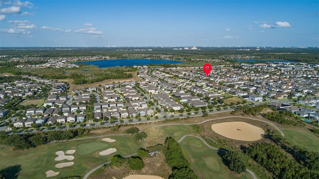 bird's eye view with view of golf course, a water view, and a residential view