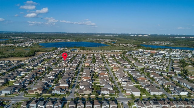 bird's eye view with a water view and a residential view