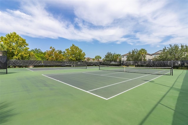 view of sport court with fence