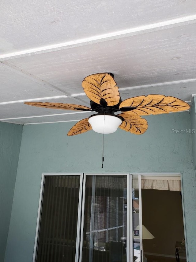 interior details featuring a ceiling fan