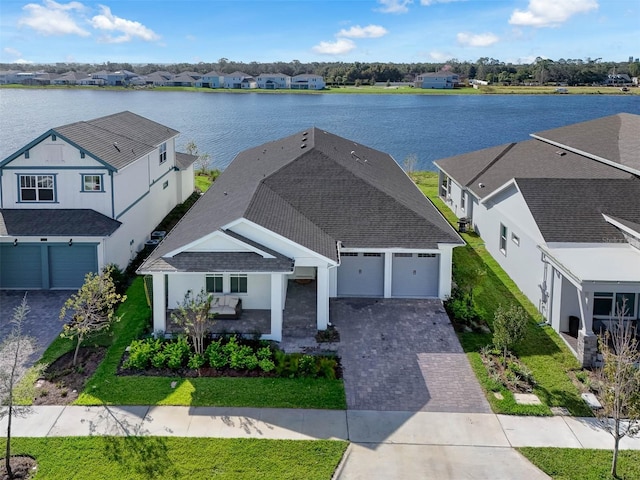 aerial view featuring a residential view and a water view