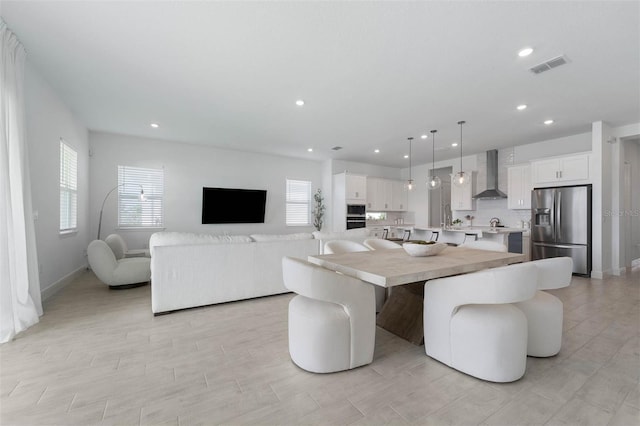 dining area with recessed lighting, visible vents, and baseboards