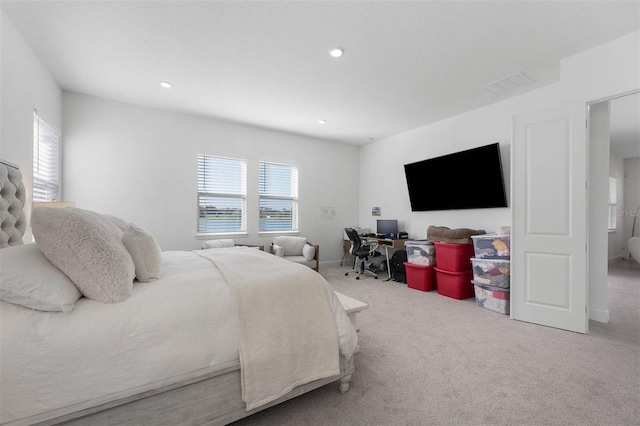 bedroom featuring recessed lighting, visible vents, and carpet