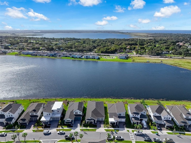 bird's eye view featuring a residential view and a water view