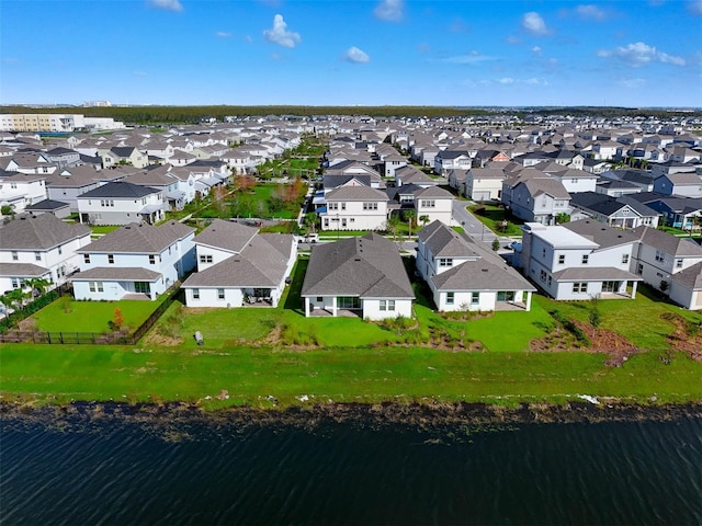 aerial view featuring a residential view and a water view