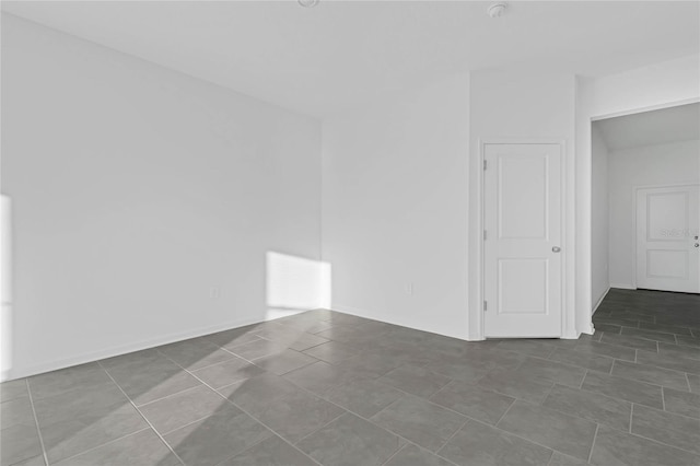 empty room featuring tile patterned floors