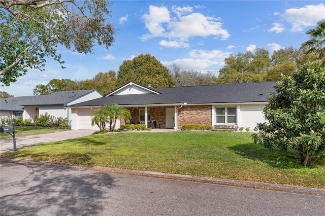 ranch-style home with driveway, brick siding, an attached garage, and a front yard