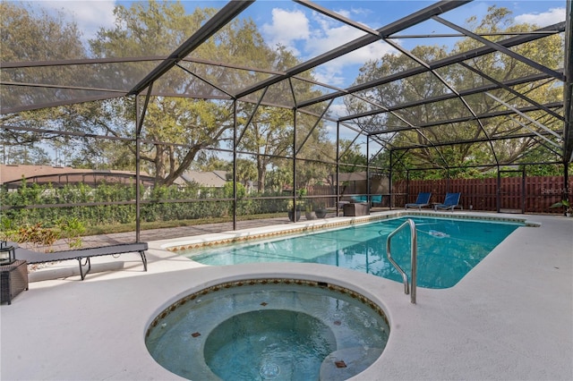 view of pool with a fenced in pool, fence, a patio, and an in ground hot tub