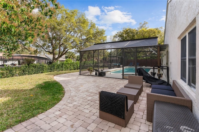 view of patio featuring a lanai and an outdoor pool